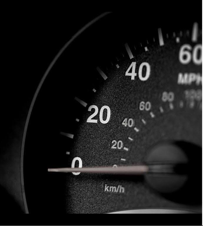 Close up of a speedometer at 0 miles per hour